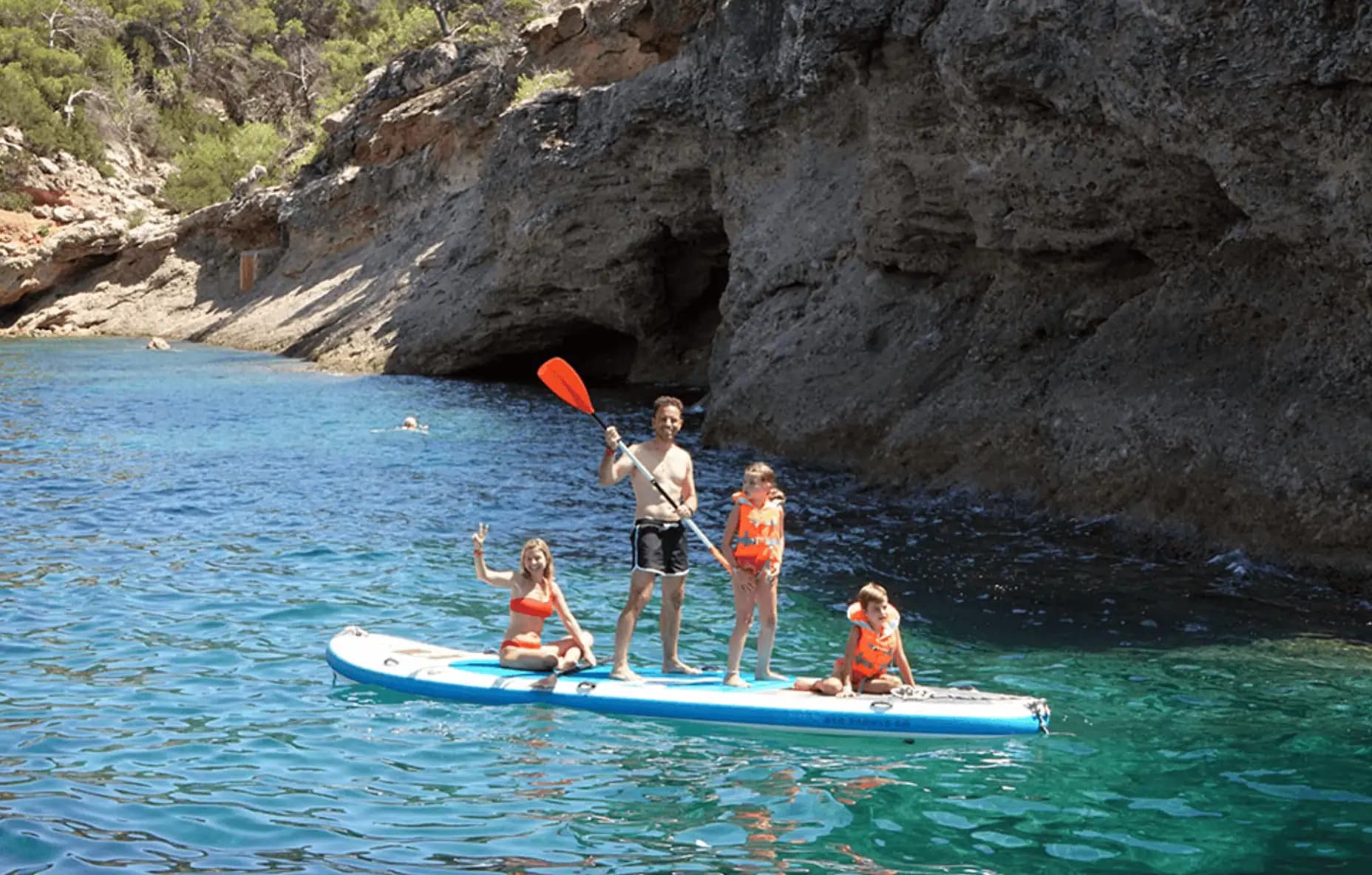Family having fun together on a paddleboard