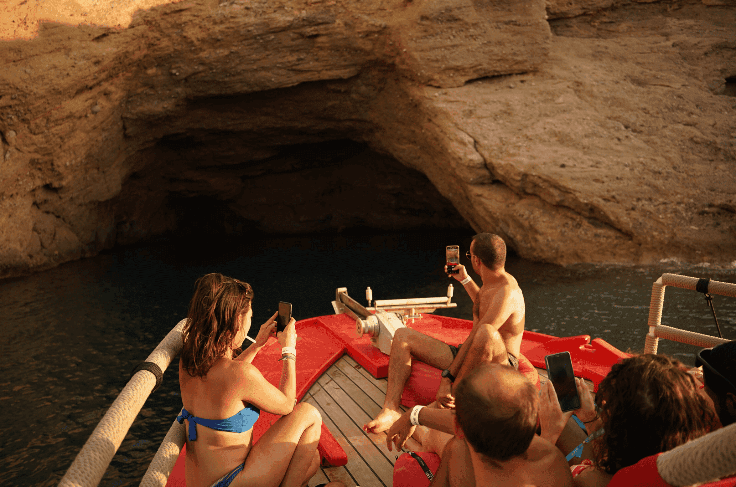 The bow of Salvador Ibiza approaching a sea cave