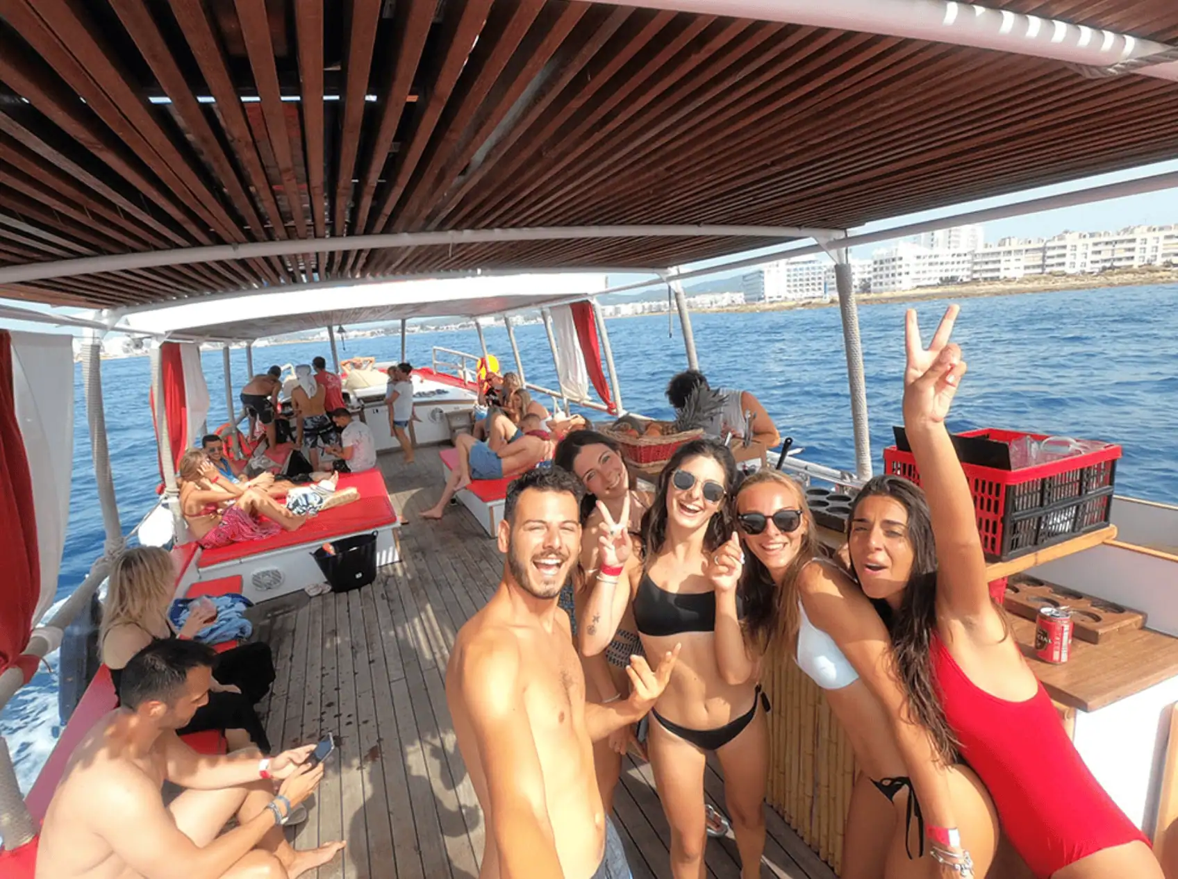 Captain Luigi on the bow with guests enjoying the moment