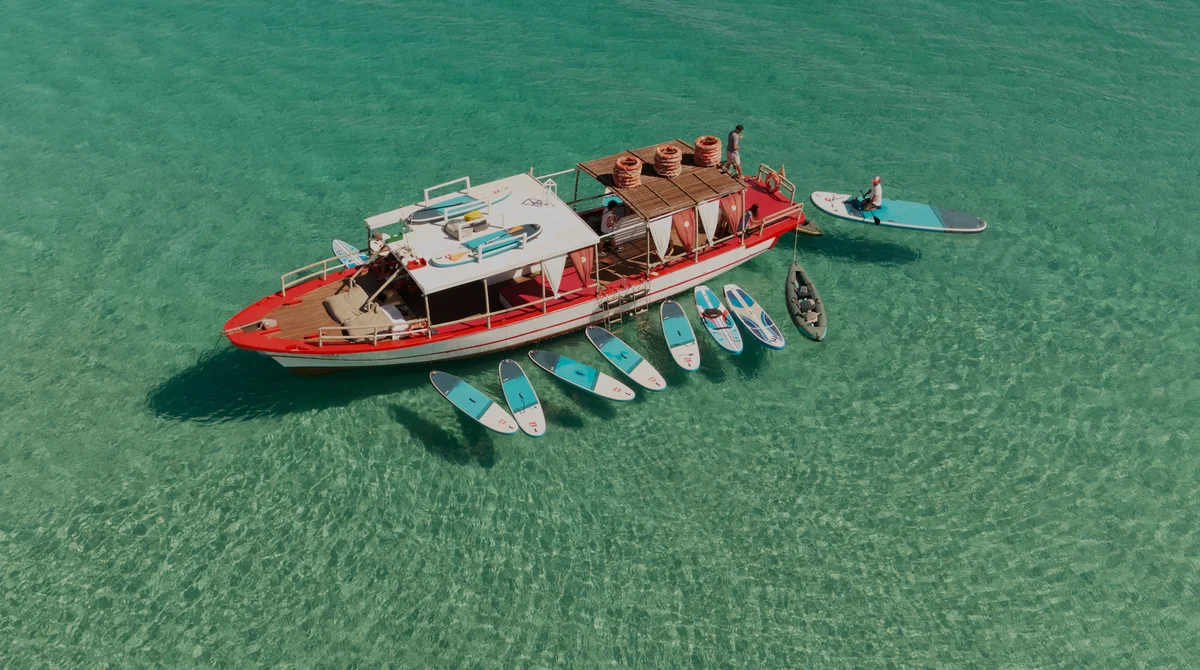 Aerial drone photo of Salvador Ibiza with its red deck in Cala Comte